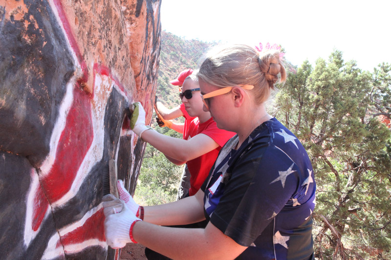 SUU students remove graffiti as part of the National Day Service. 
