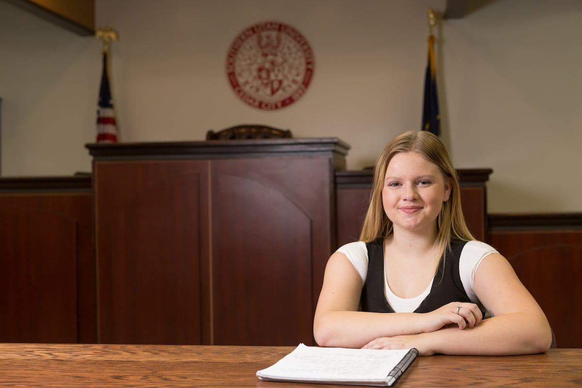 Southern Utah University student sitting in courtroom studying Bachelors degree.