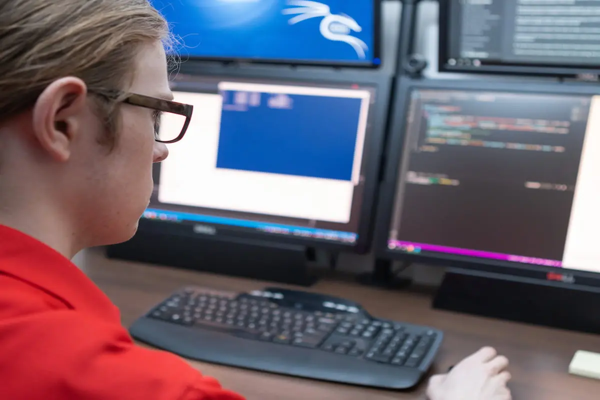 Southern Utah University student studying computer code on a computer for the bachelor degree program.