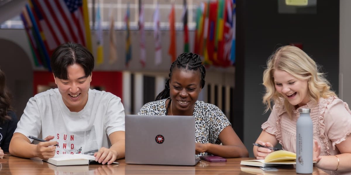 International students laughing in the student center