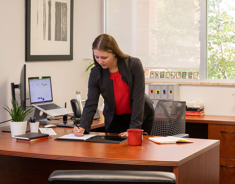 A woman at a desk doing accounting work