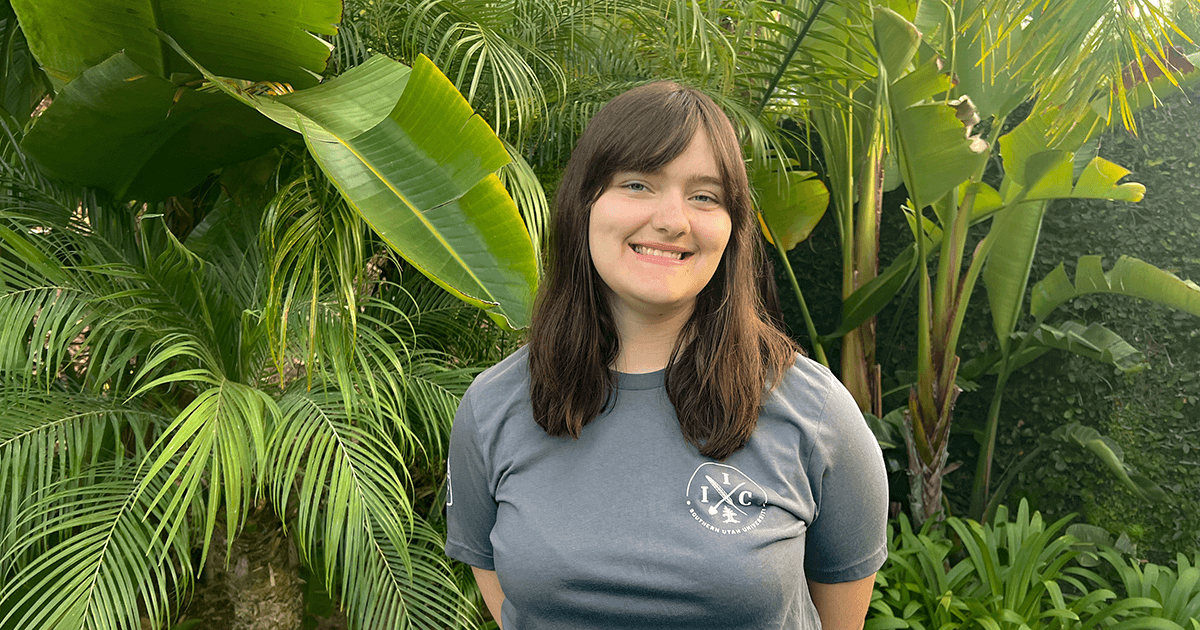 Allison Berger smiling with plants around her