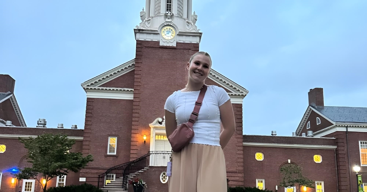 Julia Gilmore standing in front of Yale Divinity School building